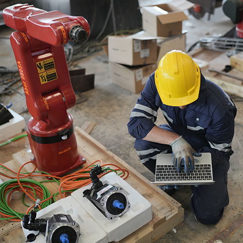 Robotic Arm engineer check on equipment in its with software of an Artificial Intelligence, Program